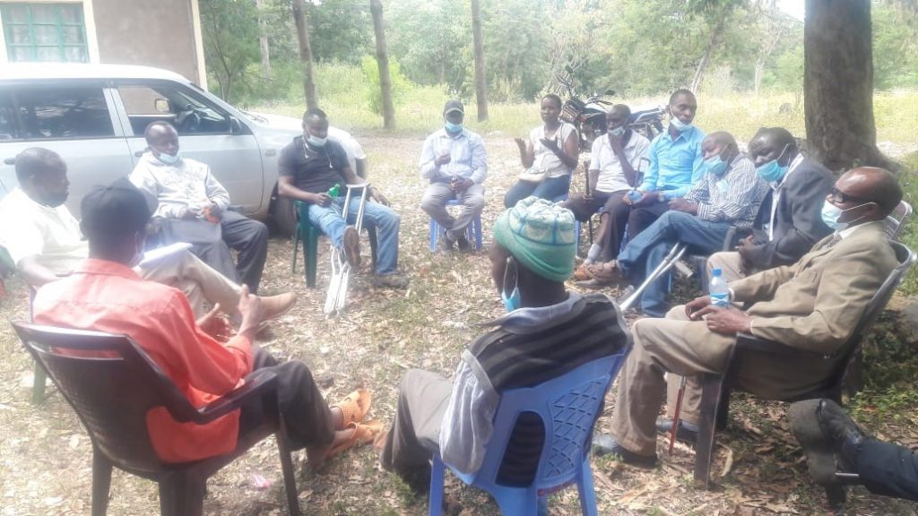 People sitting together for a Focus group discussion held in Embu county